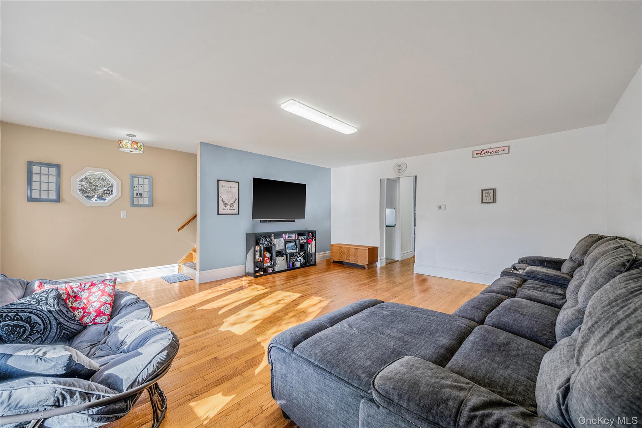 267 Dogwood Road West Mastic Beach, NY 11951 - Photo 18 of 30 a living room with furniture and a flat screen tv
