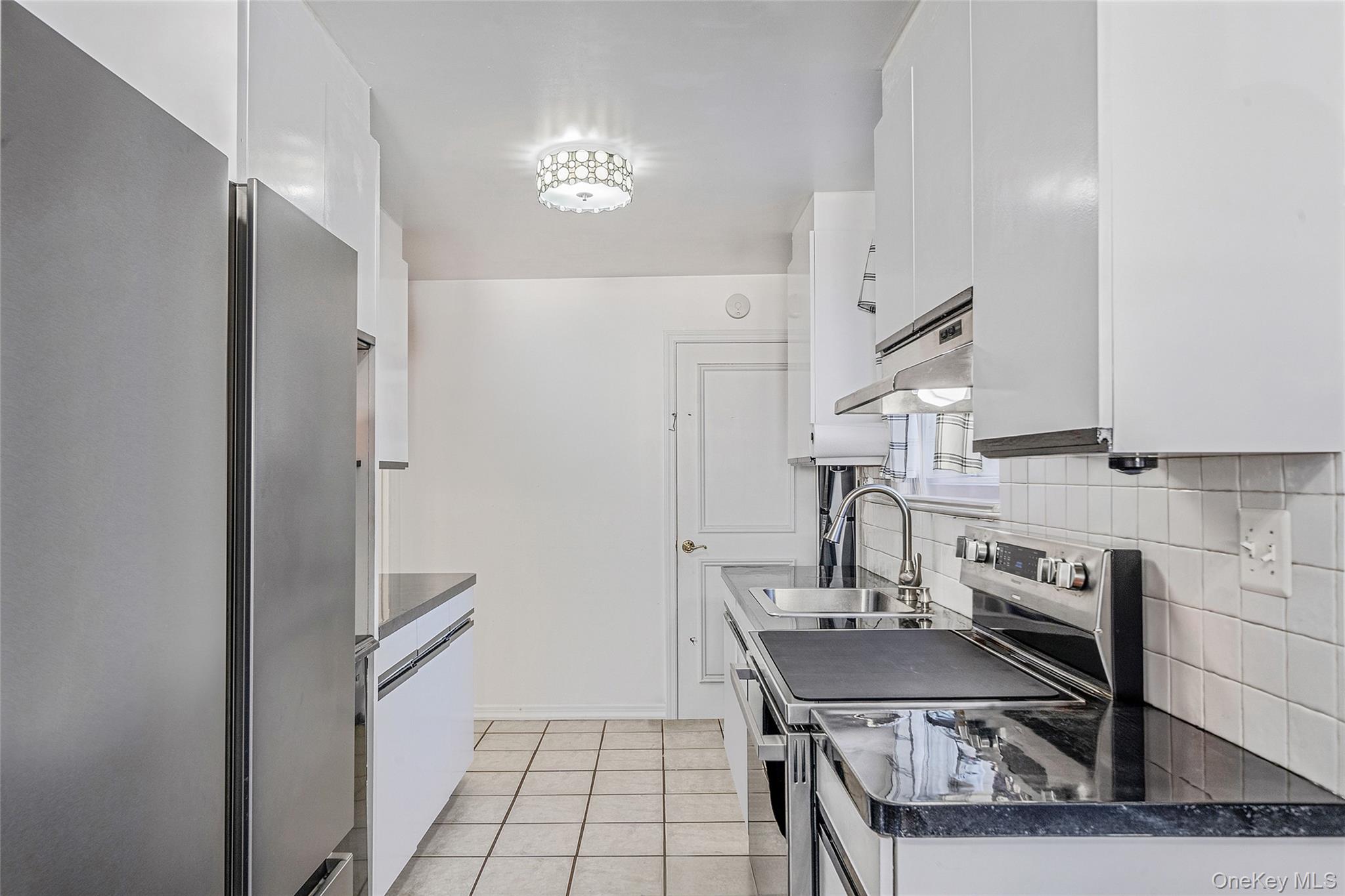 267 Dogwood Road West Mastic Beach, NY 11951 - Photo 19 of 30 a view of a kitchen from the hallway