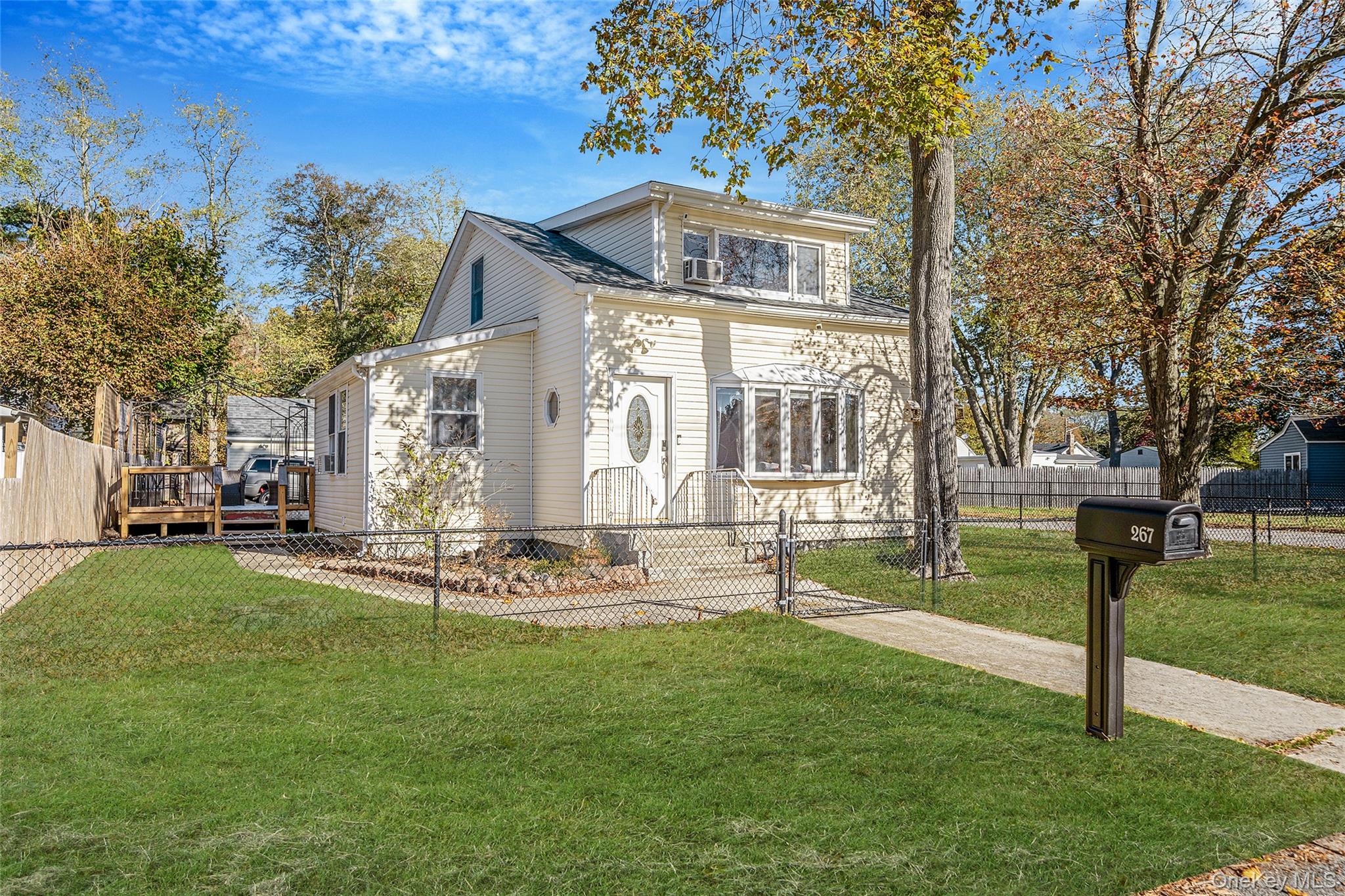 267 Dogwood Road West Mastic Beach, NY 11951 - Photo 2 of 30 a front view of a house with a yard