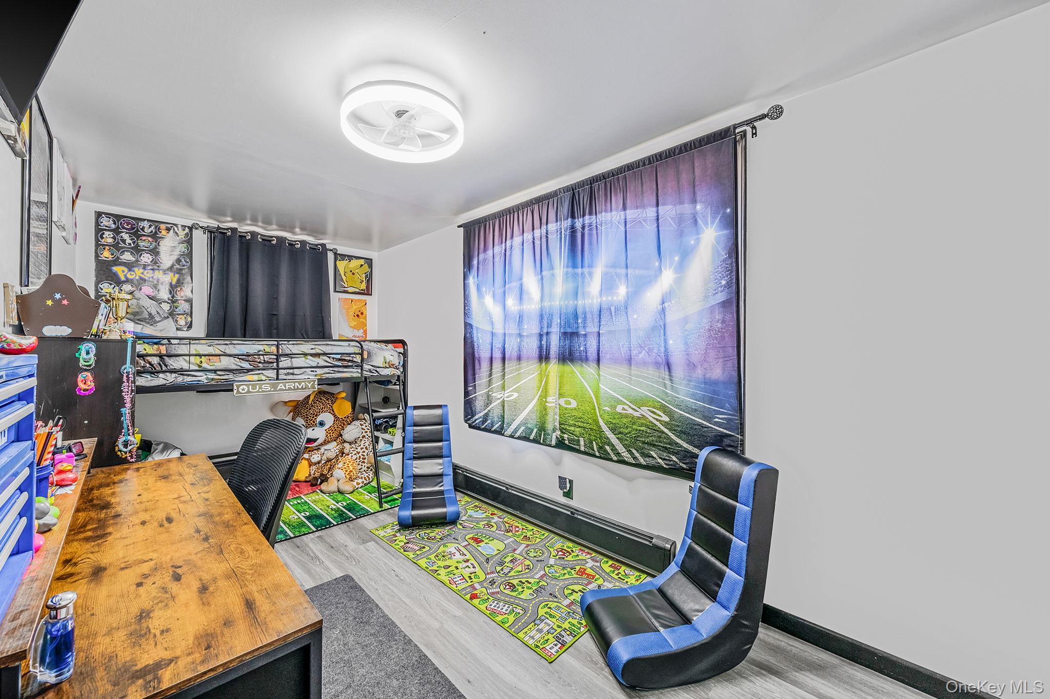 267 Dogwood Road West Mastic Beach, NY 11951 - Photo 25 of 30 a bed room with furniture and a window