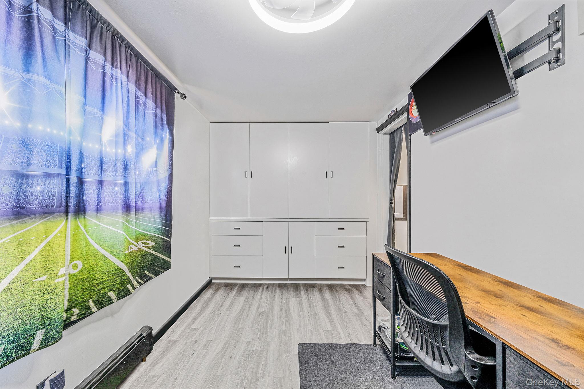 267 Dogwood Road West Mastic Beach, NY 11951 - Photo 26 of 30 a view of a room with wooden floor and windows