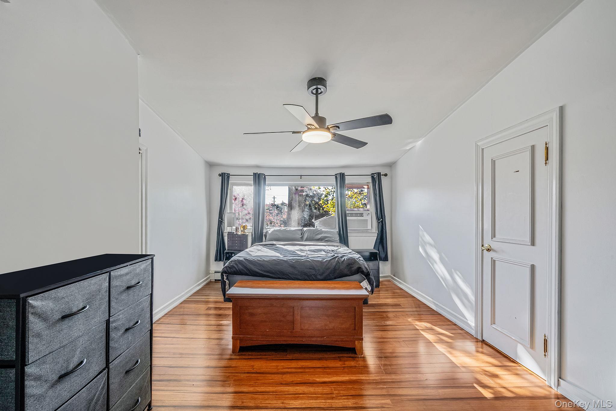 267 Dogwood Road West Mastic Beach, NY 11951 - Photo 28 of 30 a living room with furniture and a wooden floor