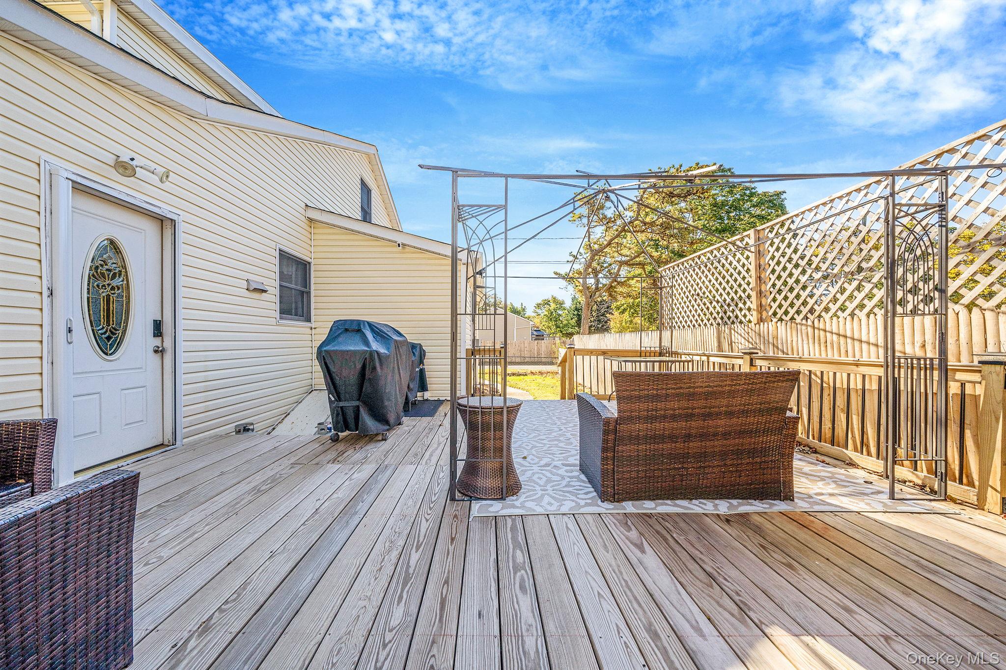 267 Dogwood Road West Mastic Beach, NY 11951 - Photo 6 of 30 a view of deck with patio