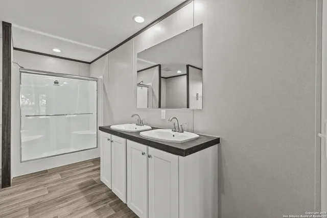 a bathroom with a sink and mirror