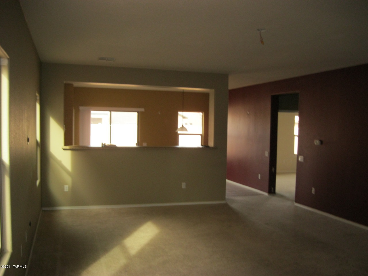 21088 East Treasure Road Red Rock, AZ 85145 - Photo 2 of 6 a view of an empty room with a window