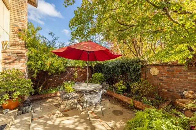 a living room with furniture large window and flat screen tv