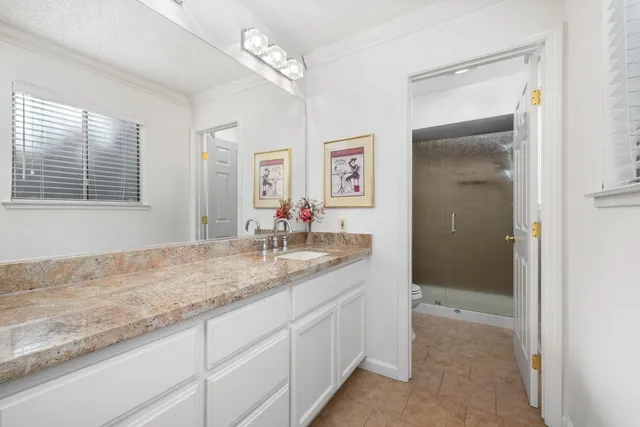 a white toilet sitting next to a bath tub