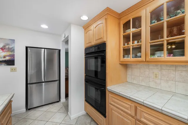 a kitchen with stainless steel appliances a refrigerator and a sink