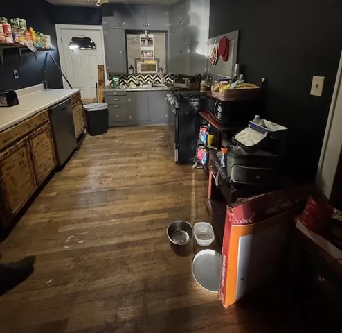 a kitchen with a stove and a refrigerator