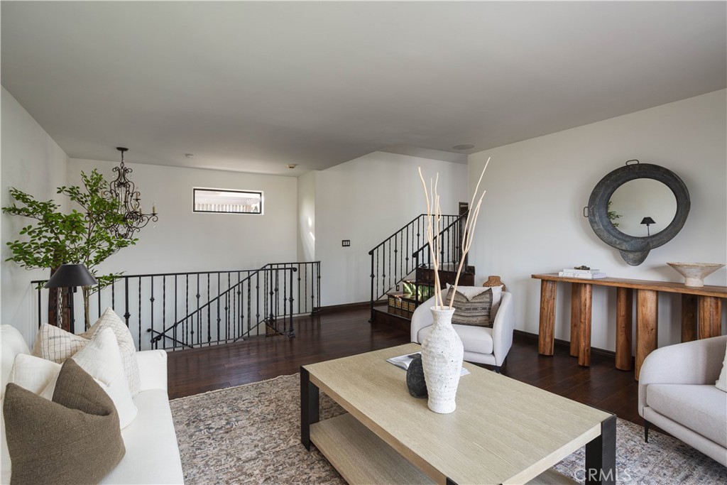 33791 Granada Drive Dana Point, CA 92629 - Photo 16 of 75 a living room with furniture and wooden floor