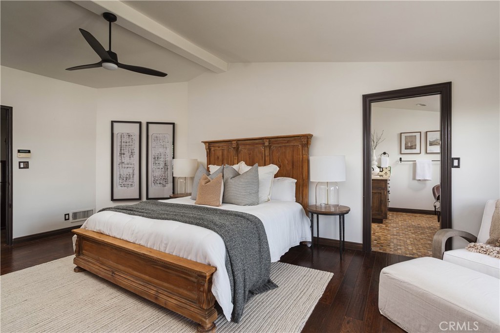 33791 Granada Drive Dana Point, CA 92629 - Photo 22 of 75 a spacious bedroom with a bed and wooden floor