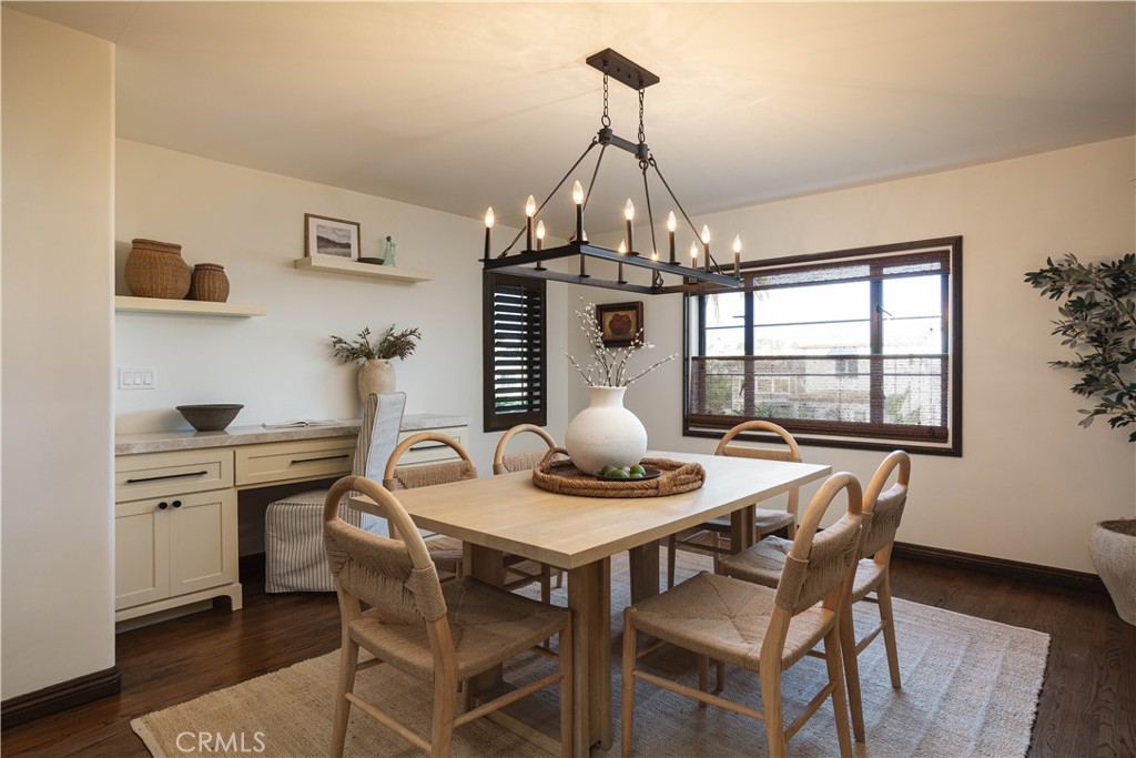 33791 Granada Drive Dana Point, CA 92629 - Photo 40 of 75 a view of a dining room with furniture a chandelier and wooden floor