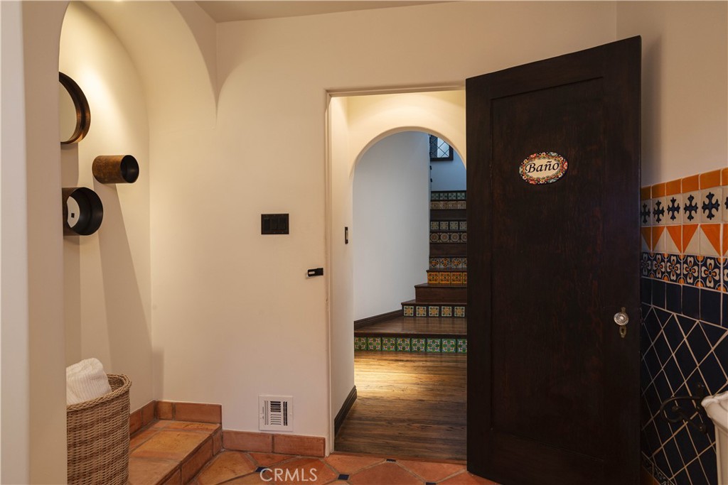33791 Granada Drive Dana Point, CA 92629 - Photo 42 of 75 a view of hallway with stairs and wooden floor