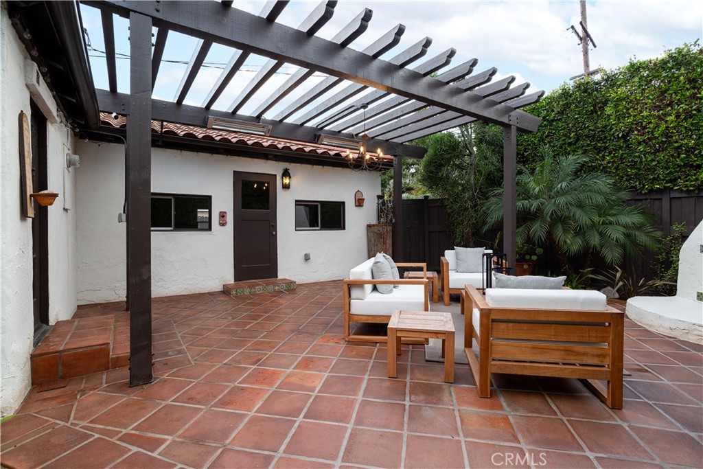33791 Granada Drive Dana Point, CA 92629 - Photo 52 of 75 a view of a patio with table and chairs with wooden floor and fence