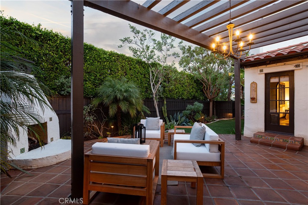 33791 Granada Drive Dana Point, CA 92629 - Photo 57 of 75 a view of patio with table and chairs potted plants with floor to ceiling window and potted plants
