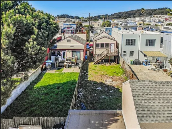 an aerial view of a house with a garden and plants