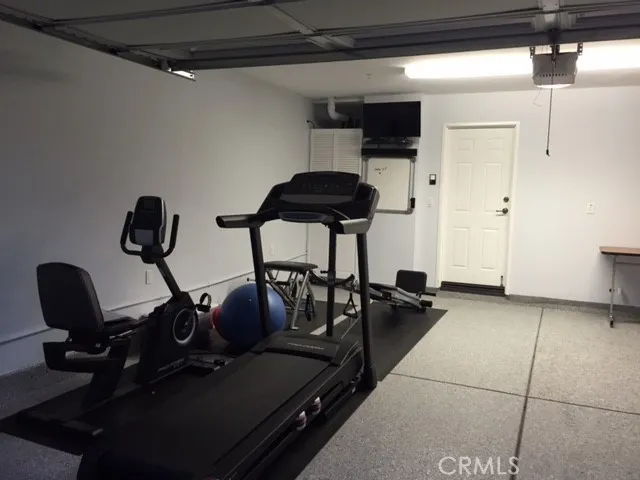 an aerial view of residential houses with outdoor space and street view