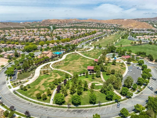 an aerial view of residential houses with outdoor space and river
