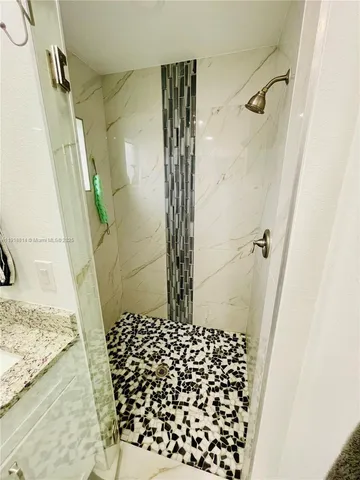 a utility room with cabinets washer and dryer
