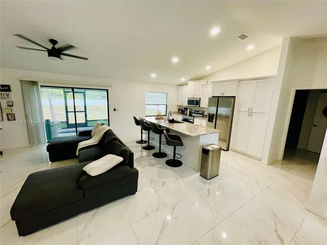 a room with furniture and a flat screen tv