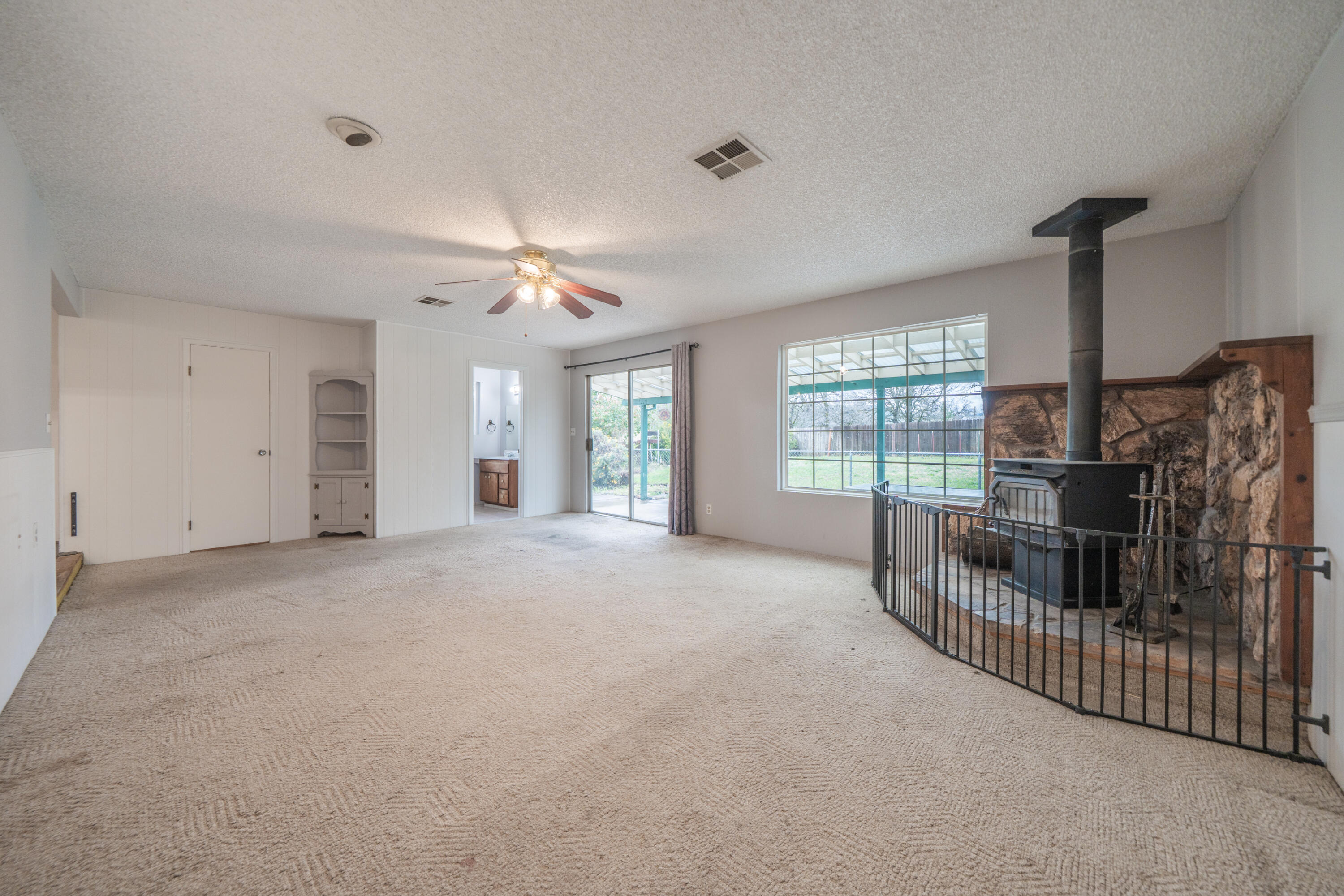 3586 East Keswick Dam Road Redding, CA 96003 - Photo 11 of 29 Family Room with Wood Stove