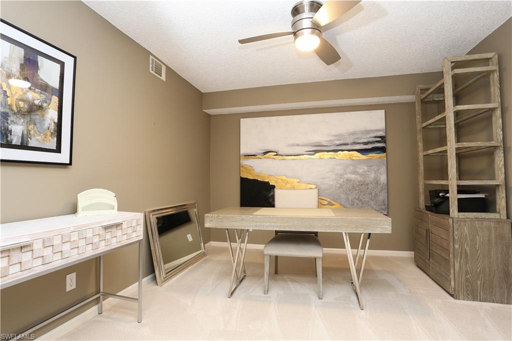 5908 Cranbrook Way, Unit I103 Naples, FL 34112 - Photo 12 of 26 a view of a dining room with furniture and a window