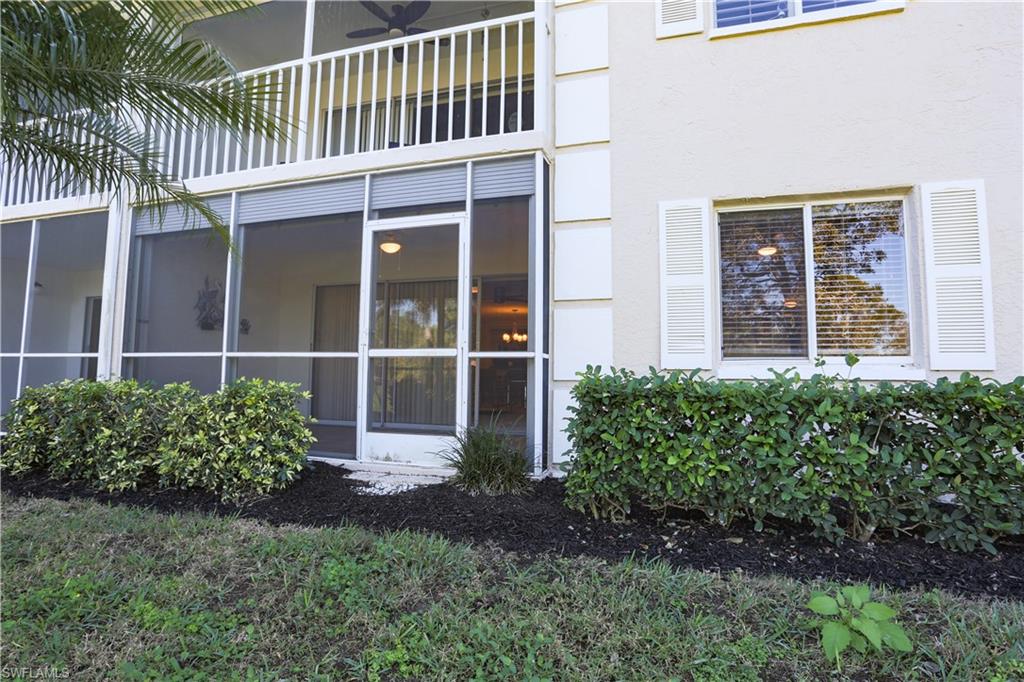 5908 Cranbrook Way, Unit I103 Naples, FL 34112 - Photo 19 of 26 a house with garden in front of it