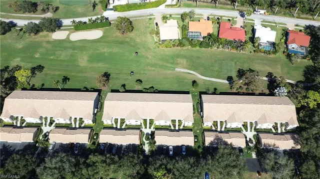 an aerial view of a house with yard swimming pool and outdoor seating