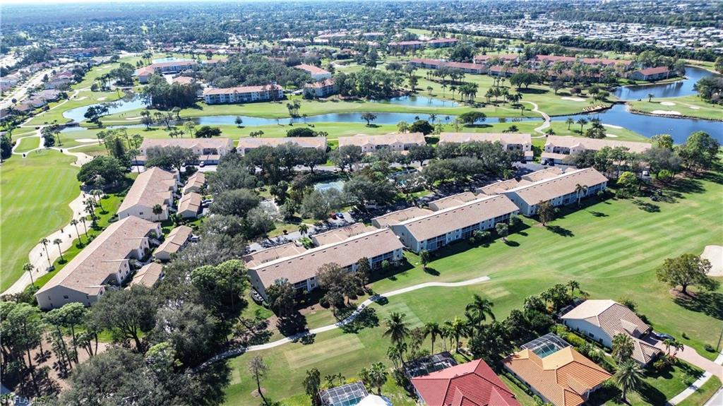5908 Cranbrook Way, Unit I103 Naples, FL 34112 - Photo 26 of 26 an aerial view of residential houses with outdoor space