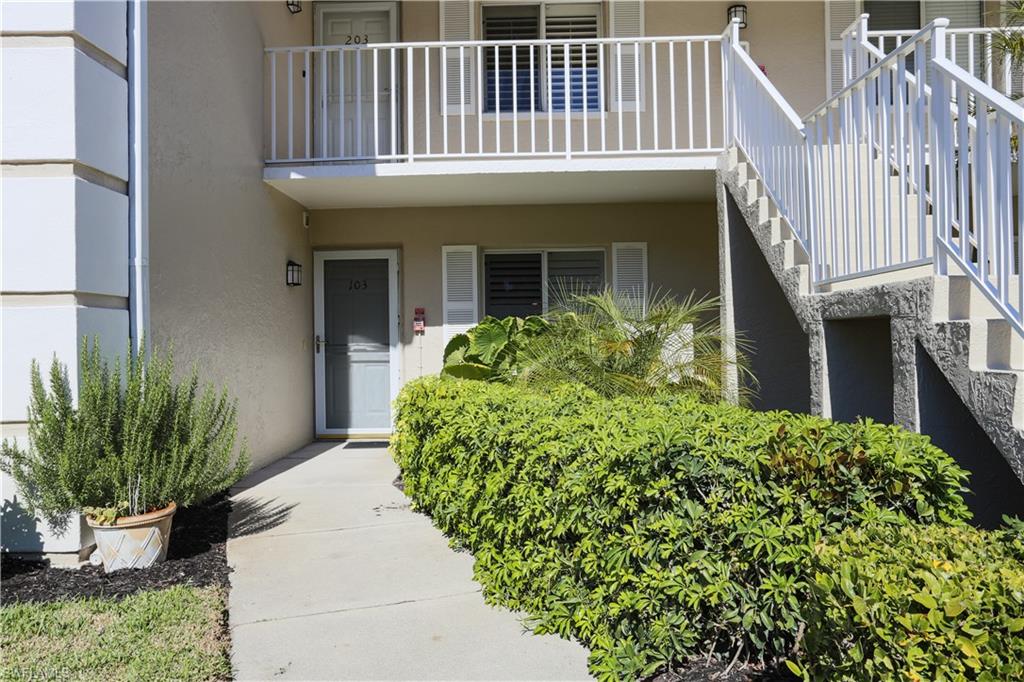 5908 Cranbrook Way, Unit I103 Naples, FL 34112 - Photo 4 of 26 a front view of a house with a porch