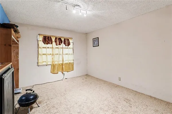 a room with a window and storage space