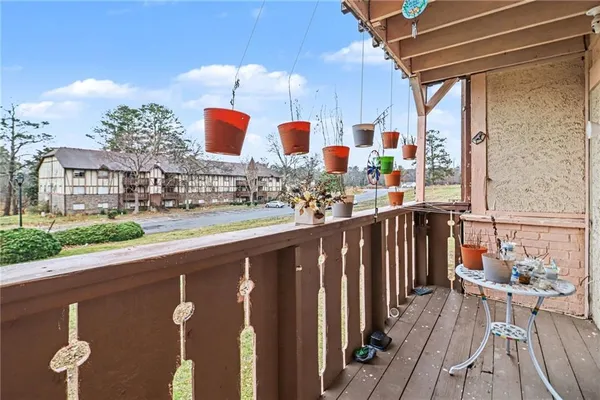 a city view from a balcony with chairs