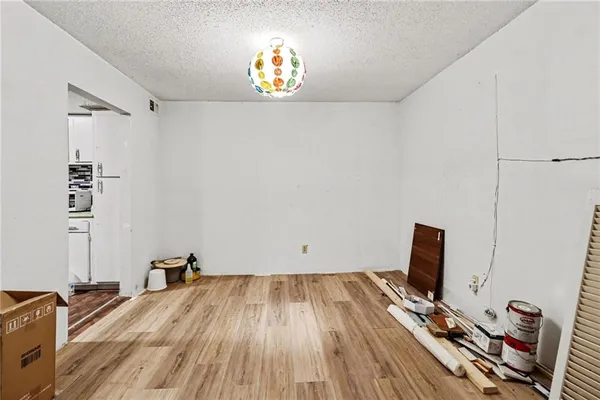 a view of a workspace with wooden floor