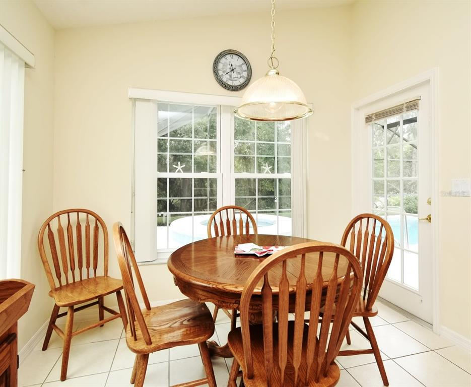 2591 Oneida Loop Kissimmee, FL 34747 - Photo 14 of 48 a view of a dining room with furniture window and outside view