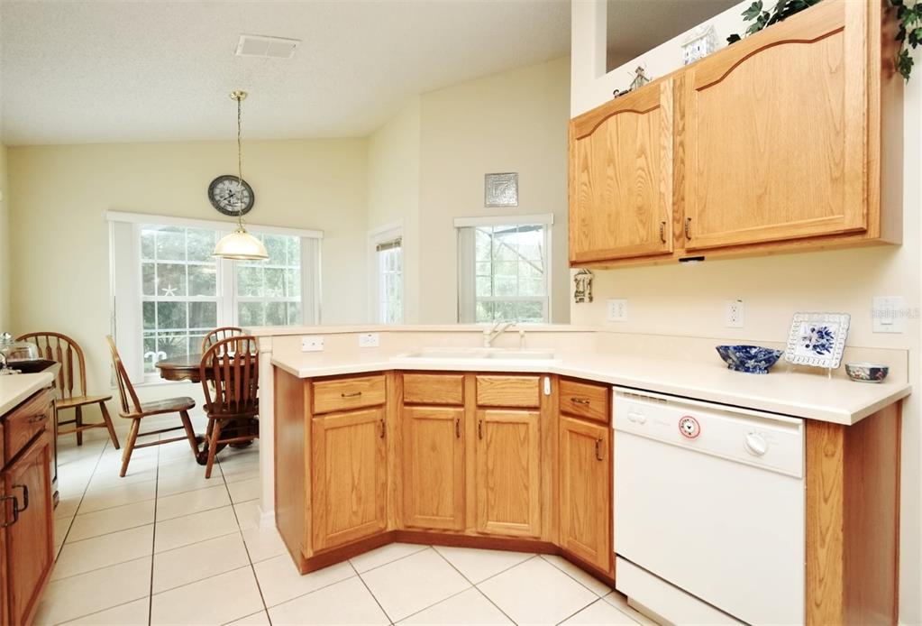2591 Oneida Loop Kissimmee, FL 34747 - Photo 20 of 48 a kitchen with stainless steel appliances granite countertop a sink and a cabinets
