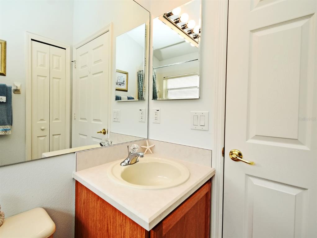 2591 Oneida Loop Kissimmee, FL 34747 - Photo 23 of 48 a bathroom with a sink toilet and shower