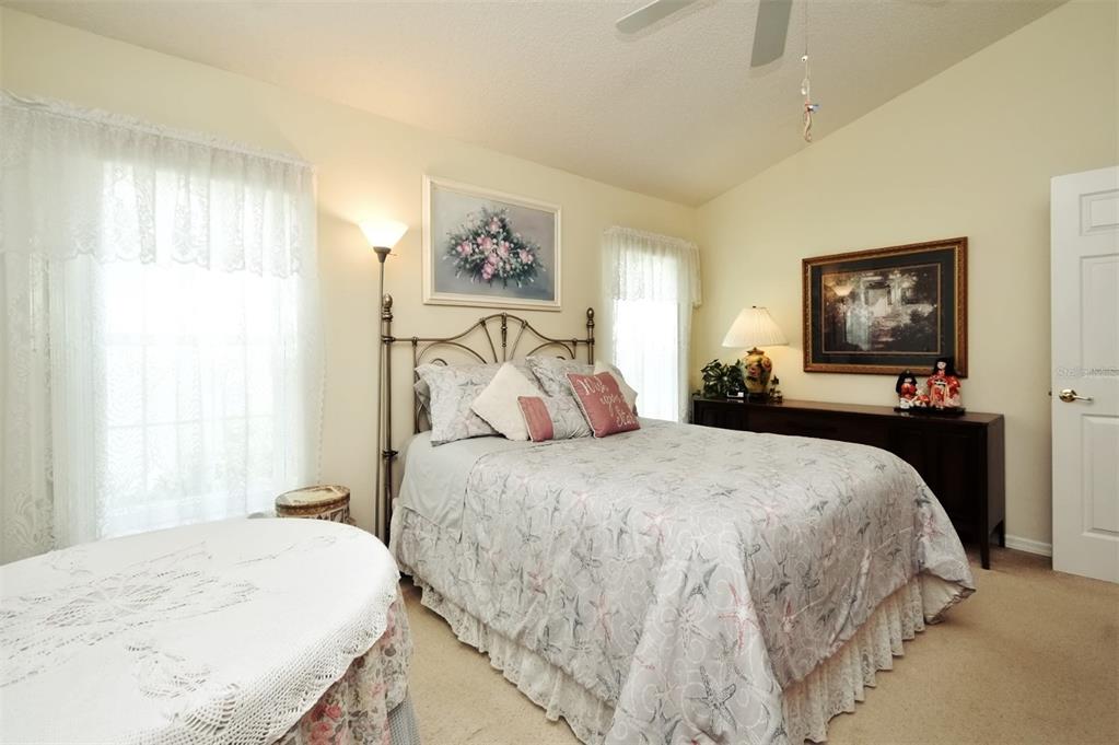 2591 Oneida Loop Kissimmee, FL 34747 - Photo 31 of 48 a bedroom with a bed and a window