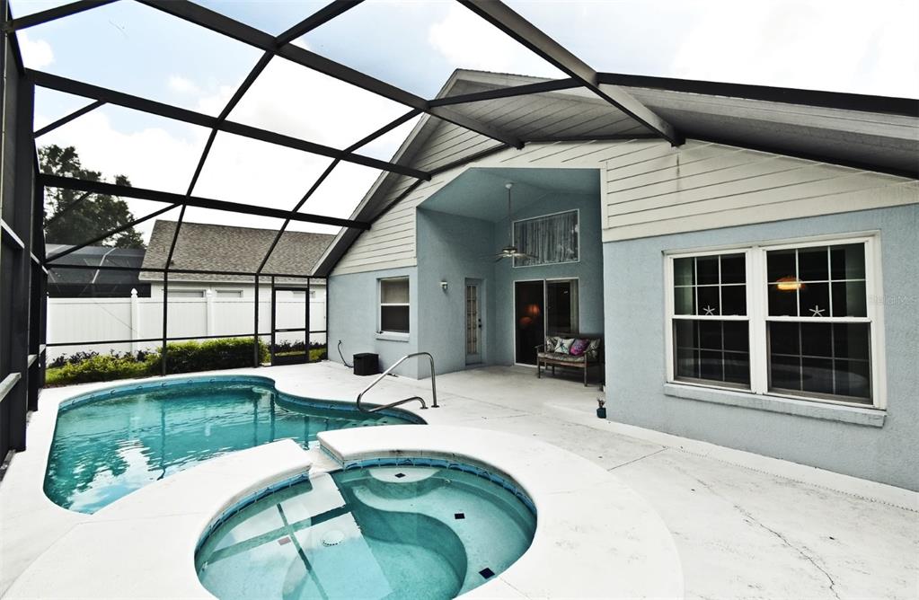2591 Oneida Loop Kissimmee, FL 34747 - Photo 38 of 48 a view of a swimming pool with a patio