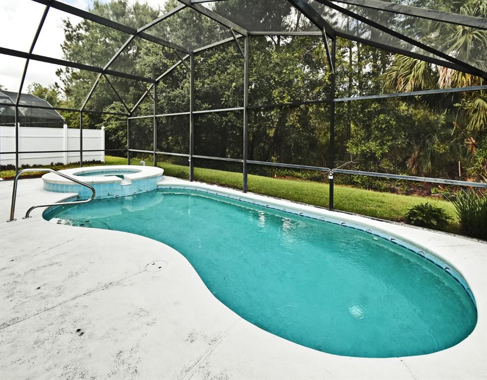 2591 Oneida Loop Kissimmee, FL 34747 - Photo 39 of 48 a view of a backyard with swimming pool