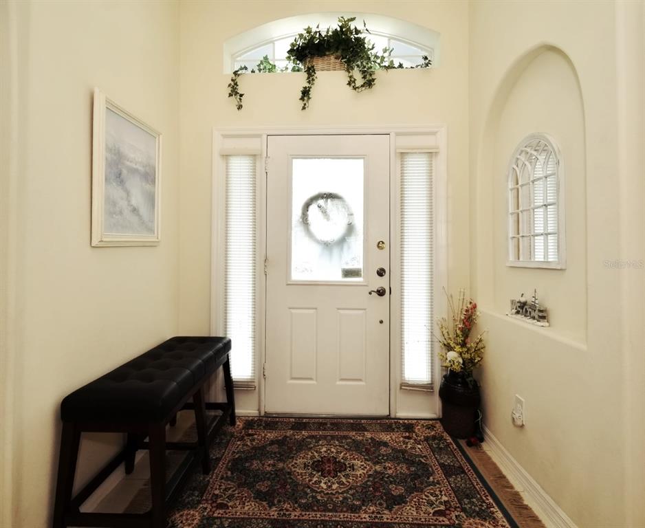 2591 Oneida Loop Kissimmee, FL 34747 - Photo 4 of 48 a room with painting and a table