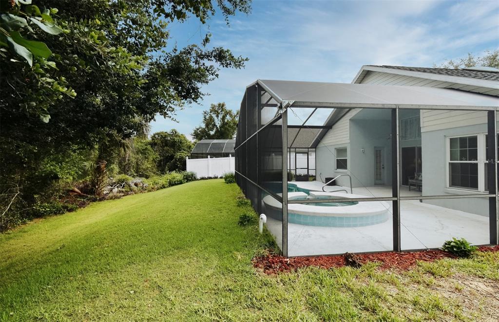 2591 Oneida Loop Kissimmee, FL 34747 - Photo 44 of 48 a front view of a house with garden