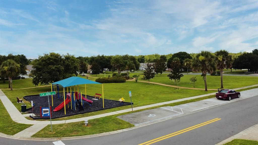 2591 Oneida Loop Kissimmee, FL 34747 - Photo 46 of 48 a view of a park with swings