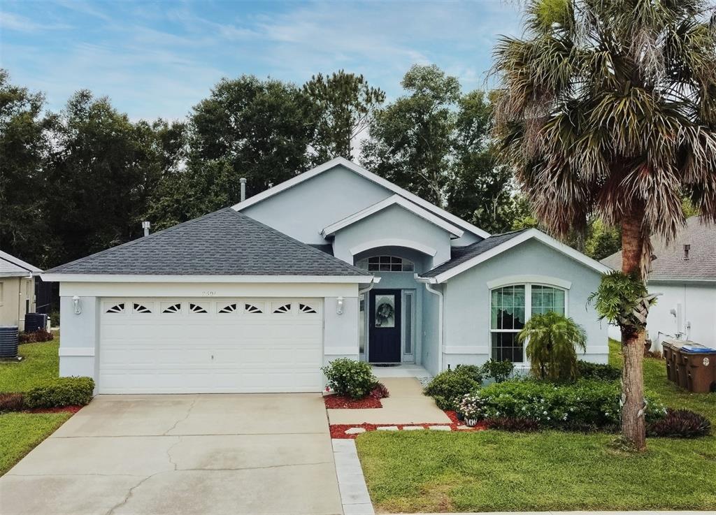 2591 Oneida Loop Kissimmee, FL 34747 - Photo 48 of 48 front view of a house with a yard
