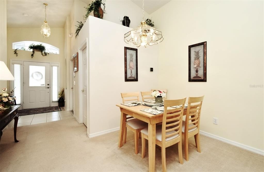 2591 Oneida Loop Kissimmee, FL 34747 - Photo 5 of 48 a view of a dining room with furniture and chandelier