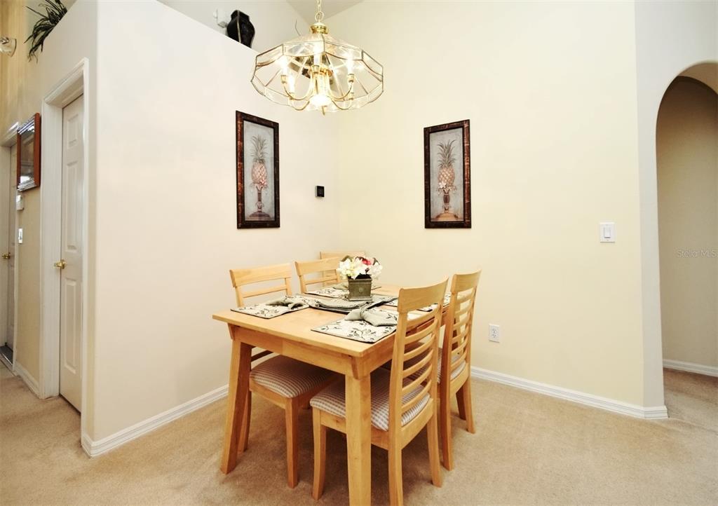 2591 Oneida Loop Kissimmee, FL 34747 - Photo 7 of 48 a view of a dining room with furniture