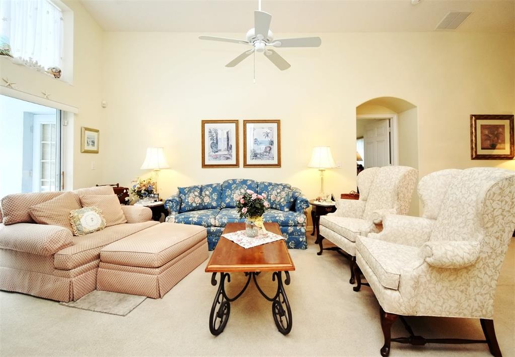 2591 Oneida Loop Kissimmee, FL 34747 - Photo 9 of 48 a living room with furniture and a window