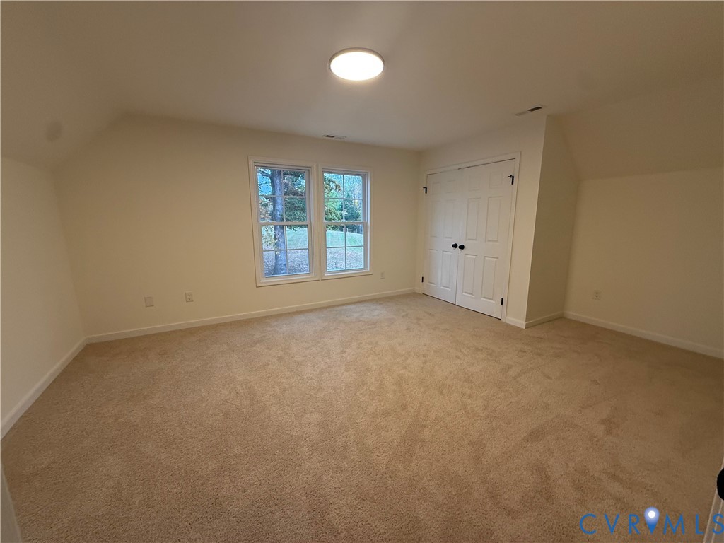 2700 Lake Albemarle Road Charlottesville, VA 22901 - Photo 17 of 25 Additional living space with vaulted ceiling and l