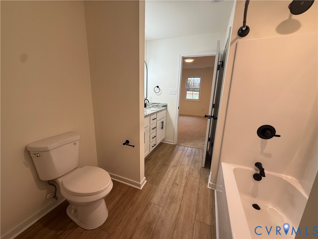 2700 Lake Albemarle Road Charlottesville, VA 22901 - Photo 21 of 25 Full bath featuring vanity, a bathtub, and light w