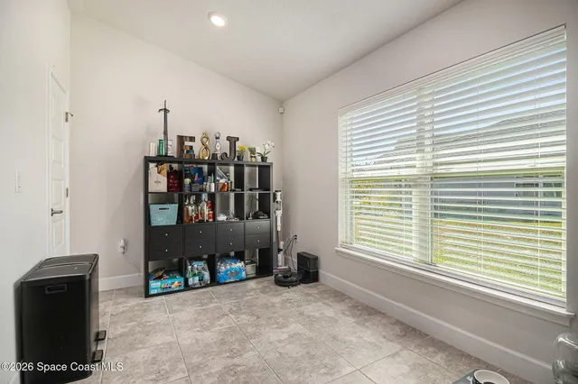 a very nice looking room with a large window and a walk in closet
