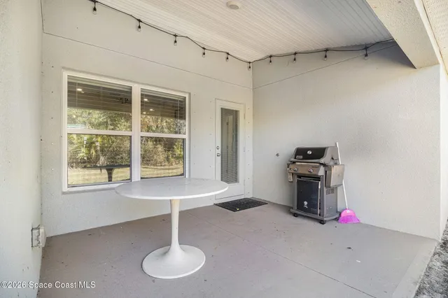 a room with window and furniture